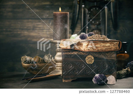 Vintage Chest with Journal and Candlelight Ambiance 127788460