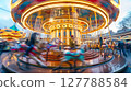 A fisheye lens captures a vintage carousel in motion, with vibrant lights and blurred figures, evoking nostalgia. 127788584