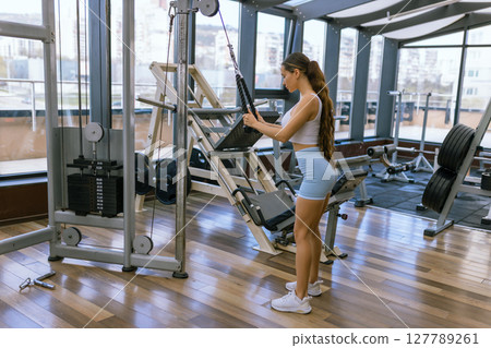 Sexy fitness woman doing exercises. Healthy lifestyle concept. Cross-fit bodybuilder in gym. Sexy fitness woman doing exercises. Healthy lifestyle concept. Cross-fit bodybuilder in gym. 127789261