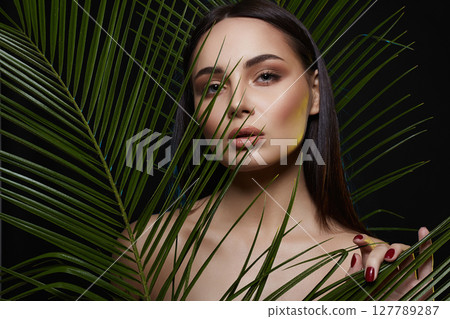 beautiful girl in palms. Beautiful woman with Make-up beautiful girl in palms. Beautiful woman with Make-up 127789287