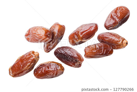 Dates fruits flying close-up on a white. Isolated Dates fruits flying close-up on a white. Isolated 127790266