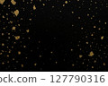 Gold leaf dancing on a black background 127790316
