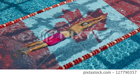 Top view of male swimmer diving into pool with Canadian flag. Global sports competition 127790357