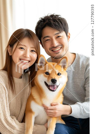 A happy morning moment between a couple and their Shiba Inu 127790393