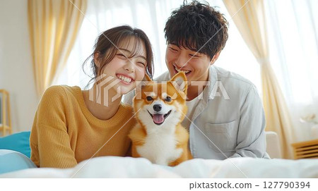 A happy morning moment between a couple and their Shiba Inu 127790394