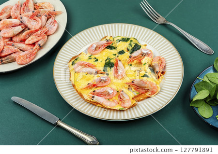 Omelet with shrimp and spinach. Omelet with shrimp and spinach. 127791891