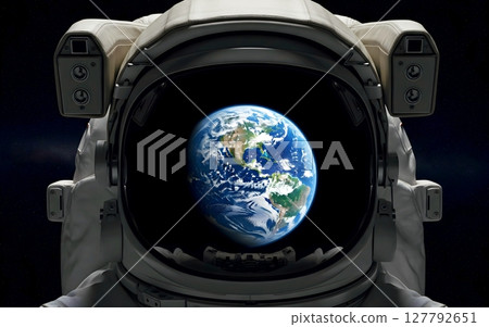 An astronaut helmet with the reflection of Earth 127792651
