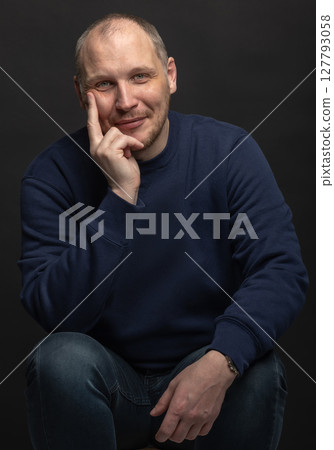 Happy man with sweatshirt studio portrait 127793058