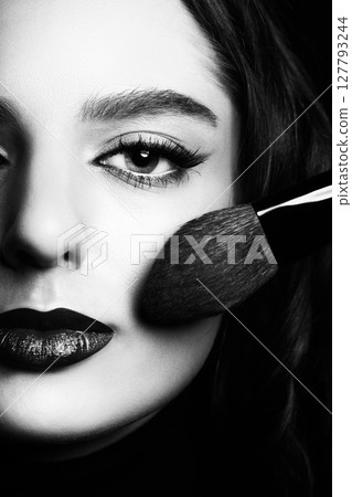 Beautiful woman with make-up and lipstick studio portrait 127793244