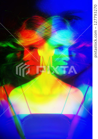 Beautiful woman with long blowing wavy hair studio portrait in RGB color split effect style Beautiful woman with long blowing wavy hair studio portrait in RGB color split effect style 127793270