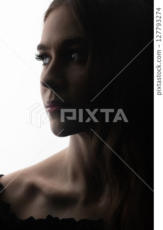 Dark face silhouette of beautiful and sexy woman 127793274