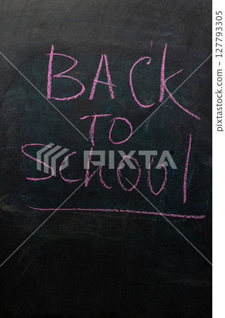 Back to School Message Written in Chalk on a Blackboard for New Academic Year Preparations 127793305