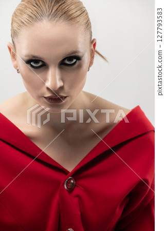 Beautiful and seductive looking woman close-up studio portrait 127793583