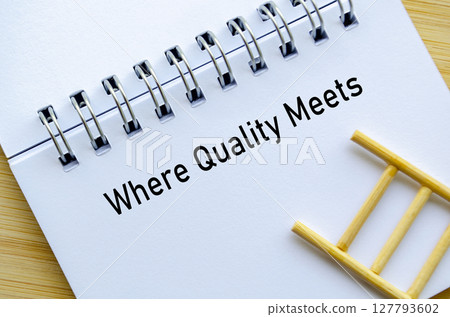 Where Quality Meets representing Your Trust Our Qualities message on notebook with ladder symbolizing growth and confidence 127793602