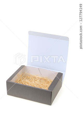 Gray cardboard gift box with brown paper packing 127794149