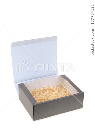 Gray cardboard gift box with brown paper packing 127794153
