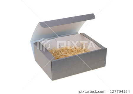 Gray cardboard gift box with brown paper packing 127794154