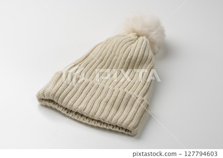 Knitted hat on a white background Knitted hat on a white background 127794603