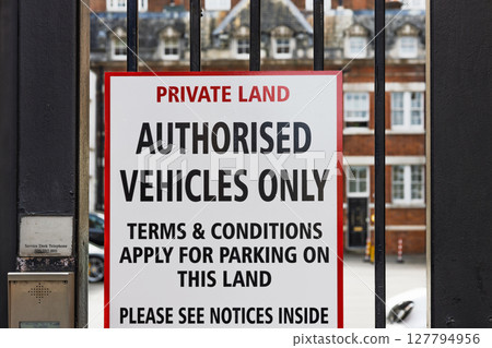 Private Land Sign on Black Iron Gate. Authorised Vehicles Only, Parking Terms Apply 127794956