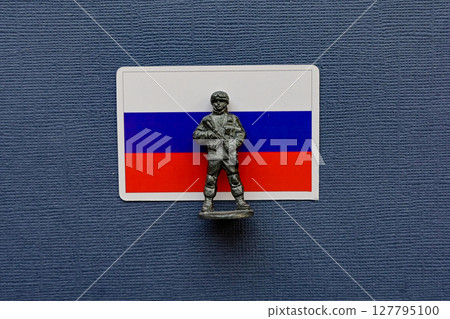 Flags of Russia on a blue background. The Russian-Ukrainian conflict. 127795100