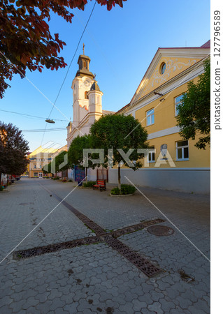 uzhhorod, ukraine - jun 04, 2017: catholic church of st. george on a voloshyna street on a summer morning. old european architecture of a downtown 127796589