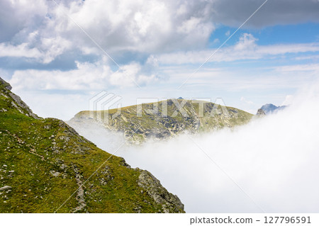 mountain landscape of romania under cloudy sky. europe nature scenery travel background for hiking in summer vacation season. scenic view of fagaras ridge in transylvania alps with steep rocky slopes 127796591