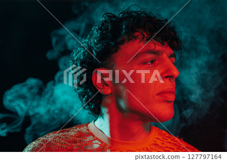 Glamourous Man In Smoke Neon Green Light, Night Club. Portrait Sexy Guy In Smoke Glamourous Man In Smoke Neon Green Light, Night Club. Portrait Sexy Guy In Smoke 127797164