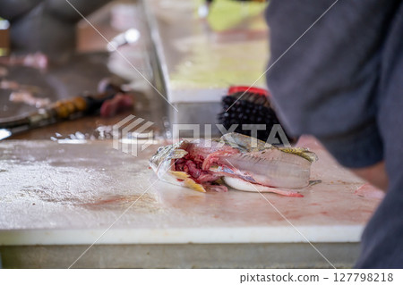 Leftover skin and guts from a fillet walleye fish 127798218