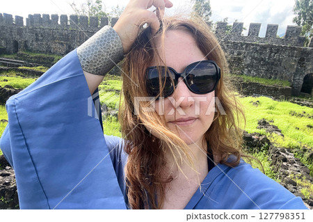 Pretty woman in sunglasses taking a selfie, portrait. Happy holiday and vacation concept 127798351