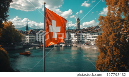 Swiss flag waving in the wind during a sunset celebration of independence and national pride Swiss flag waving in the wind during a sunset celebration of independence and national pride 127798482