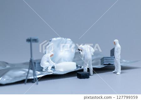 Miniature Crime Scene Investigation on Pill Blister Pack Miniature Crime Scene Investigation on Pill Blister Pack 127799359