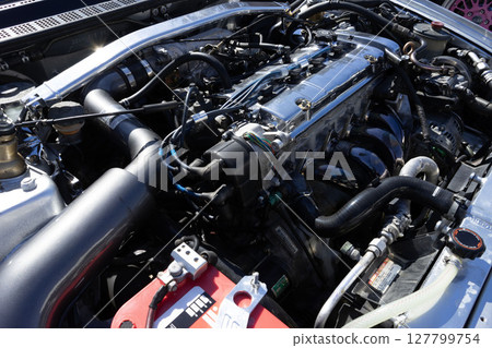 Car engines, under the hood of modified cars, tuning machines 127799754