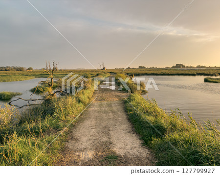 View of sunset on Ria de Aveiro, Ovar, Portugal. 127799927