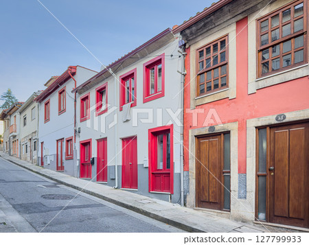 Picturesque view of old houses and streets of Vila Real town at sunny autumn morning, north of Portugal. Picturesque view of old houses and streets of Vila Real town at sunny autumn morning, north of Portugal. 127799933