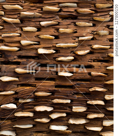 threshing board of aged wood and stones texture 127800150