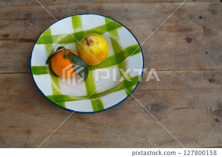 fruits tangerine and pear in vintage porcelain dish plate retro 127800158