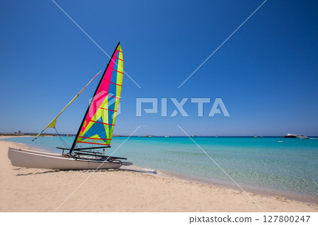 Catamaran sailboat in Illetes beach of Formentera Catamaran sailboat in Illetes beach of Formentera 127800247