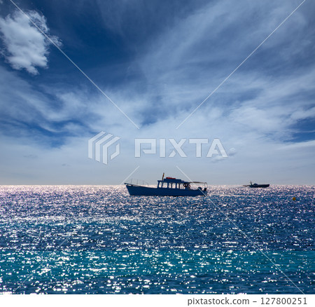 Mediterranean sea with boats in Balearic Islands 127800251