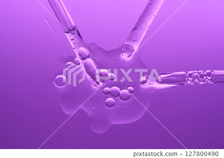 Cosmetic gel or serum on a lilac background with three pipettes. Cosmetic gel or serum on a lilac background with three pipettes. 127800490