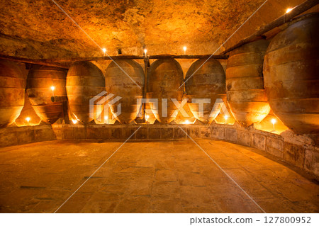 Antique winery in Spain with clay amphora pots 127800952