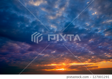 Dramatic sky with stormy clouds in sunset 127801291