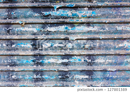 Grunge rusty iron door texture with stripes and old papers 127801389