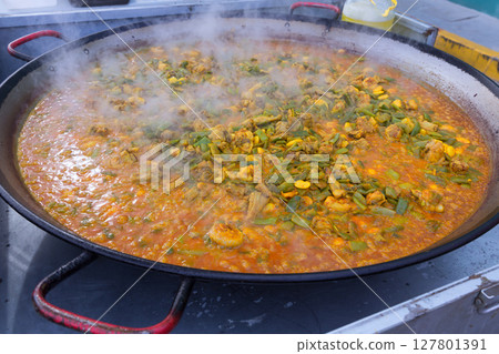 Cooking paella typical from Valencia Spain recipe with rice 127801391