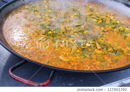 Cooking paella typical from Valencia Spain recipe with rice 127801392