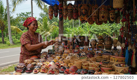 Indonesian Woman Selling Traditional Handcrafted Masks and Woven Baskets at Outdoor Market 127802503