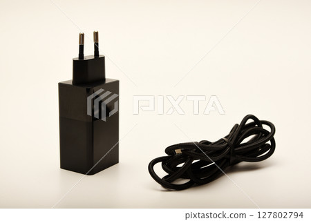 A new charger for gadgets with a wire. USB charging with a wire. 127802794