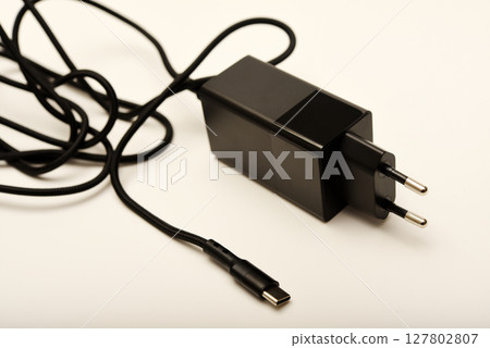 A new charger for gadgets with a wire. USB charging with a wire. 127802807