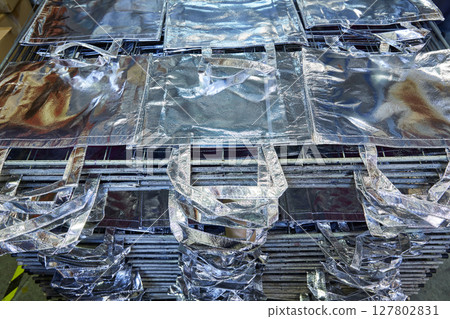 bags factory in silver fabric stacked 127802831