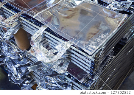 bags factory in silver fabric stacked 127802832