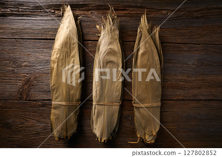 Dried Bamboo leaves in brown for Zongzi recipe 127802852